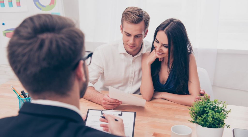 A young married couple at OTP Insurance is looking into a contract